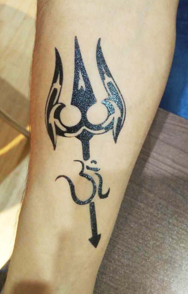Trishul With Om Tattoo | Om tattoo, Hand and finger tattoos, Tattoos